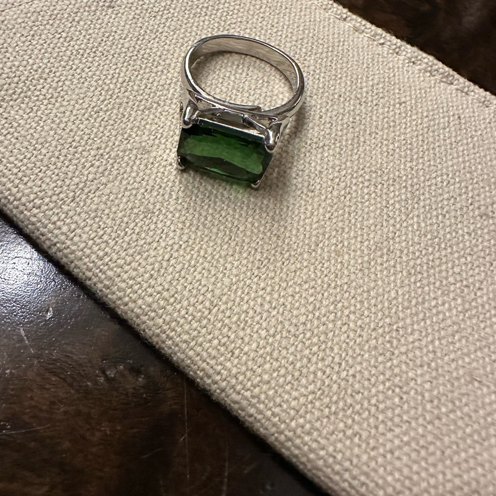 Emerald color silver plated adjustable cocktail ring.
